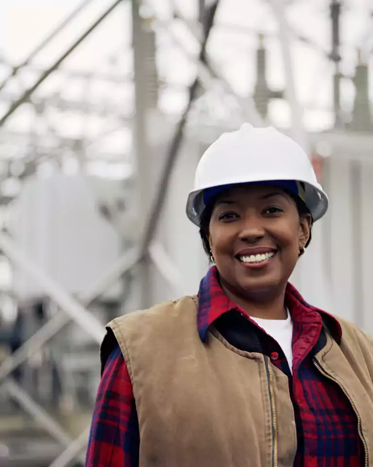 people - smiling woman in hard hat outside